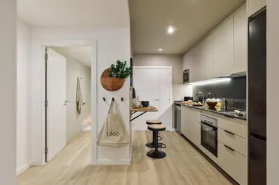 a living room with a couch and a table at Cadaques - 1 bedroom and balcony in Sant Antoni in Barcelona