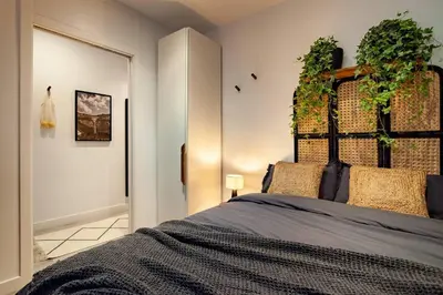 a dining room with a black and gold wall at Quena - 2 bedrooms and balcony in Eixample Dreta in Barcelona