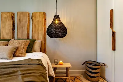 a living room with a couch and a bed at Quena - 2 bedrooms and balcony in Eixample Dreta in Barcelona