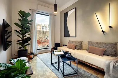 a bedroom with a large bed and a window at Akita - 2 bedrooms, terrace in Eixample Esquerra in Barcelona