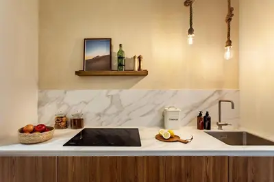 a living room with a couch and a table with candles at Siwa - 2 bedrooms in Eixample Dreta in Barcelona