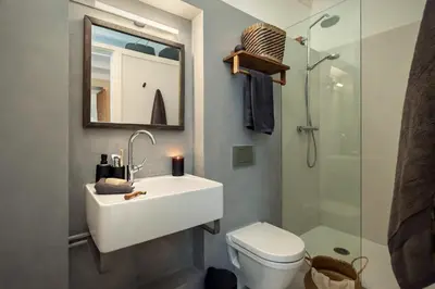 a bedroom with a large bed with a table on it at Fuji - 2 bedrooms and terrace in Eixample Esquerra in Barcelona
