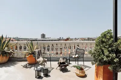 a bathroom with a sink and a toilet and a mirror at Fuji - 2 bedrooms and terrace in Eixample Esquerra in Barcelona