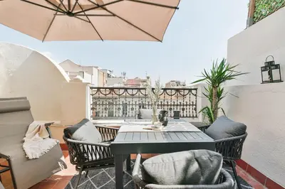 a bathroom with a toilet and a glass shower at Ascea - 2 bedroom and terrace in Eixample Esquerra in Barcelona