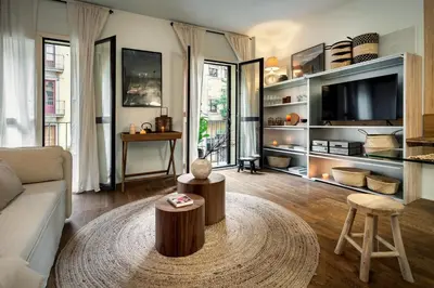 a living room with a couch and a table at Shokai - 1 bedroom in Ciutat Vella in Barcelona