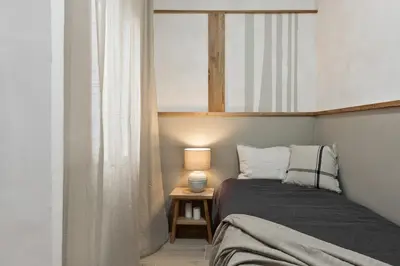 a desk with a lamp and a chair in a room at NIVE - 3 bedrooms apartment in Sant Gervasi in Barcelona