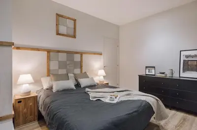 a living room with a couch and a table at Giralda - 3 bedrooms in Sagrada Família in Barcelona