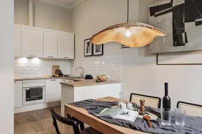 a desk in a room with a chair and a mirror at Krasner - 3 bedrooms in Eixample Dreta in Barcelona