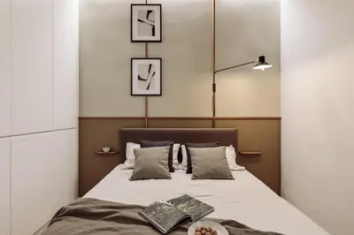 a living room with a couch and a bedroom at Gava - 3 bedrooms and terrace in Sagrada Família in Barcelona