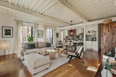 a living room with a couch and a table at Taksim - 2 bedrooms and balcony in La Barceloneta in Barcelona