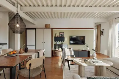 a living room with a couch and a table at Taksim - 2 bedrooms and balcony in La Barceloneta in Barcelona