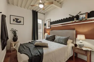 a living room with a table and a couch at Taksim - 2 bedrooms and balcony in La Barceloneta in Barcelona