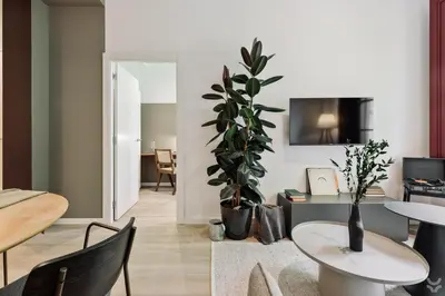a living room with a couch and a table at Aire - 1 bedroom and balcony in Sant Antoni in Barcelona