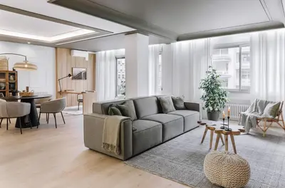 a living room with a couch and a table at Aran - 3 bedrooms in Eixample Esquerra in Barcelona