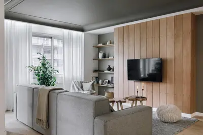 a bedroom with a large white bed and a table at Aran - 3 bedrooms in Eixample Esquerra in Barcelona