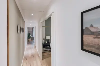 a hallway with a picture of a house at Senes - 2 bedrooms in Eixample Esquerra in Barcelona