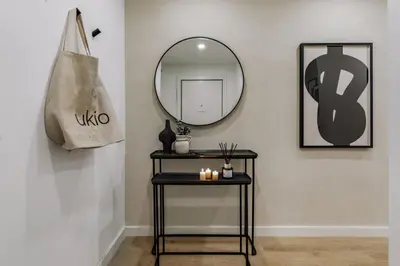 a living room with two couches and a bedroom at Basquiat - 2 bedrooms and office in Sant Gervasi in Barcelona