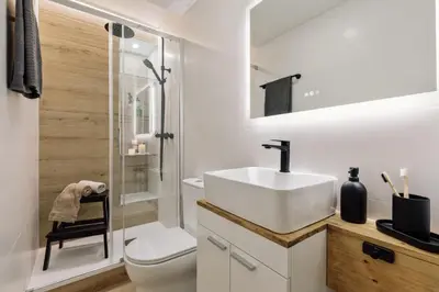 a bedroom with a large bed with a wooden tray on it at Basquiat - 2 bedrooms and office in Sant Gervasi in Barcelona