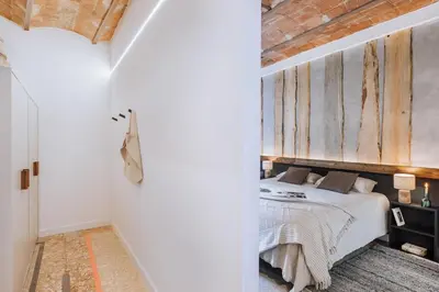 a bedroom with a bed with a teddy bear on it at Feliu - 2 bedrooms in Eixample Dreta in Barcelona
