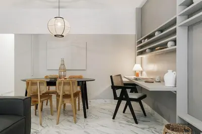 a living room with a couch and a tv at Equense - 2 bedrooms in Sant Gervasi in Barcelona
