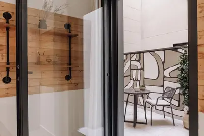 a living room with a couch and a table with candles at Tibi - 2 bedrooms and office in Eixample Esquerra in Barcelona