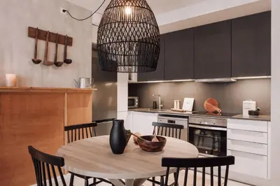 a bedroom with a bed with two lights above it at Tibi - 2 bedrooms and office in Eixample Esquerra in Barcelona