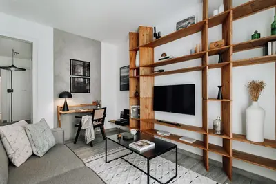 a living room with a couch and a dining room table at Ziga - 2 bedrooms in Sagrada Família in Barcelona