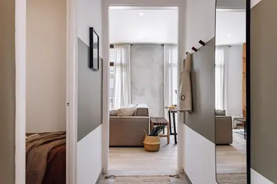 a living room with a couch and a tv at Ziga - 2 bedrooms in Sagrada Família in Barcelona