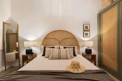 a living room with a fireplace and a mirror at Batik - 2 bedrooms and terrace in Eixample Dreta in Barcelona
