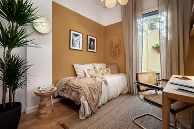 a bedroom with a large bed and a window at Sahoro - 2 bedrooms and terrace in Gràcia in Barcelona