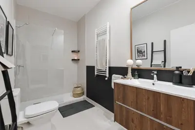a bathroom with a white toilet and a sink at Mourene - 3 bedrooms in Eixample Dreta in Barcelona