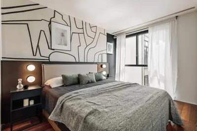 a living room with a table and chairs at Lewitt - 1 bedroom in Eixample Dreta in Barcelona