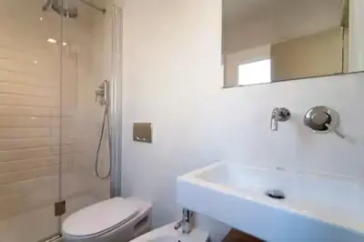 a bathroom with a toilet and a sink and a shower at Charmant appartement à Vila de Gracia Barcelone in Barcelona