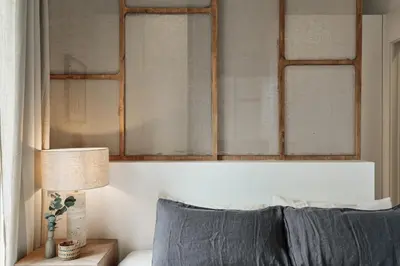 a white kitchen with white cabinets and a table at Caris - 2 bedrooms and balcony in Les Corts in Barcelona