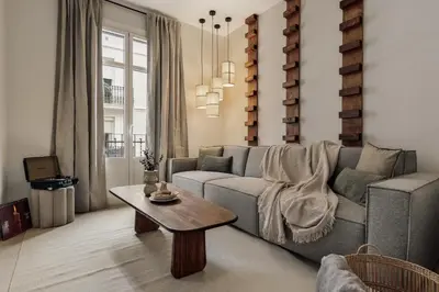 a living room with a couch and a table at Zafiro - 3 bedrooms and balcony in Sants in Barcelona