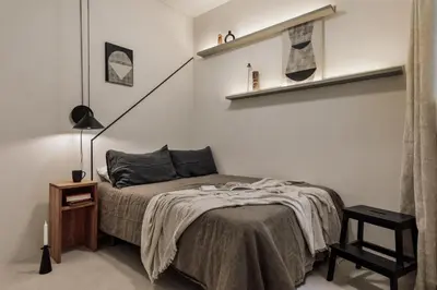 a dining room with a table and chairs and windows at Zafiro - 3 bedrooms and balcony in Sants in Barcelona