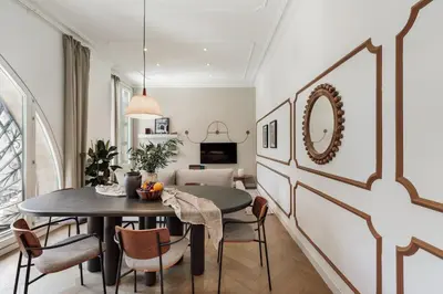a dining room with a table and chairs at Halea - 3 bedrooms w/ terrace in Eixample Esquerra in Barcelona