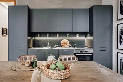 a room with a bench in front of a window at Tella - 2 bedrooms and office in Eixample Esquerra in Barcelona