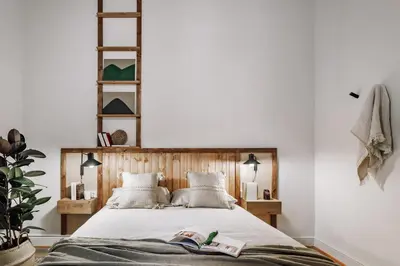a bedroom with a bed and a large window at Tella - 2 bedrooms and office in Eixample Esquerra in Barcelona