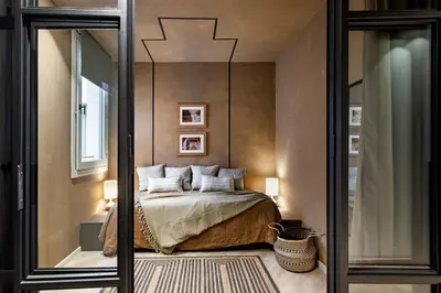 a bathroom sink with a mirror and a candle at Hamid - 2 bedrooms in Eixample Dreta in Barcelona