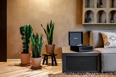 a dining room with a table and some plants at Hamid - 2 bedrooms in Eixample Dreta in Barcelona