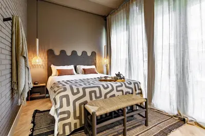 a bedroom with a bed and a large mirror at Hamid - 2 bedrooms in Eixample Dreta in Barcelona