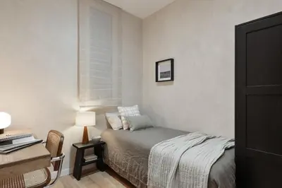 a room with a balcony with a table and chairs at Sazos - 2 bedrooms in Sant Antoni in Barcelona