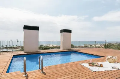 a bathroom with a shower and a toilet and a sink at Minori - 2 bedrooms and pool in Poblenou in Barcelona