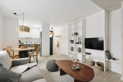 a desk with a chair and a lamp in a room at Minori - 2 bedrooms and pool in Poblenou in Barcelona