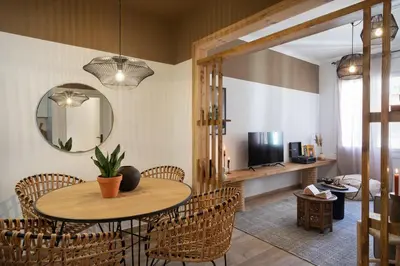 a mirror in a bedroom with a bed at Adigrat - 3 bedrooms in Gràcia in Barcelona