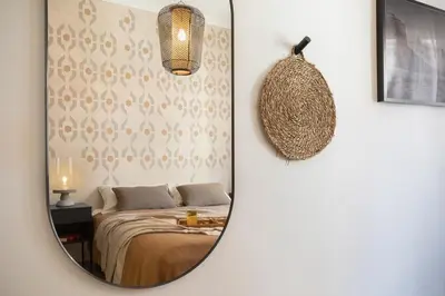 a bathroom with a sink and a shower with a mirror at Adigrat - 3 bedrooms in Gràcia in Barcelona