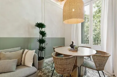 a bedroom with a bed and a desk and a window at Scala - 2 bedrooms in Sant Gervasi in Barcelona