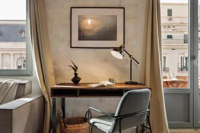 a living room with a table and chairs at Kuta - 2 bedrooms and balcony in Sant Gervasi in Barcelona