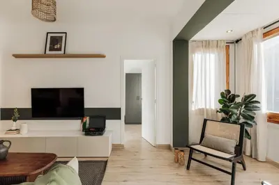 a small office with a desk and a cabinet at Demir - 2 bedrooms and office in Vila de Gràcia in Barcelona